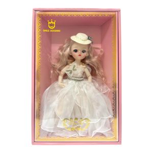 MUÑECA EN CAJA ARTICULADA CON VESTIDO